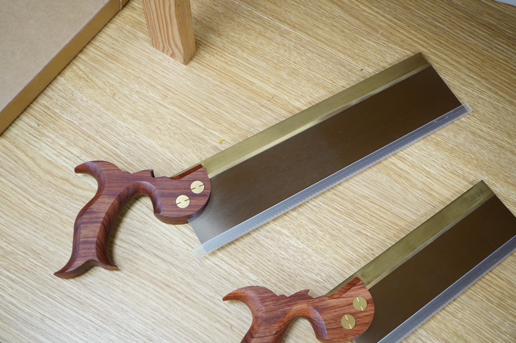 Two boxed Canadian Adria Toolworks Inc. wood saws; a small tenon rip saw, together with a dovetail saw